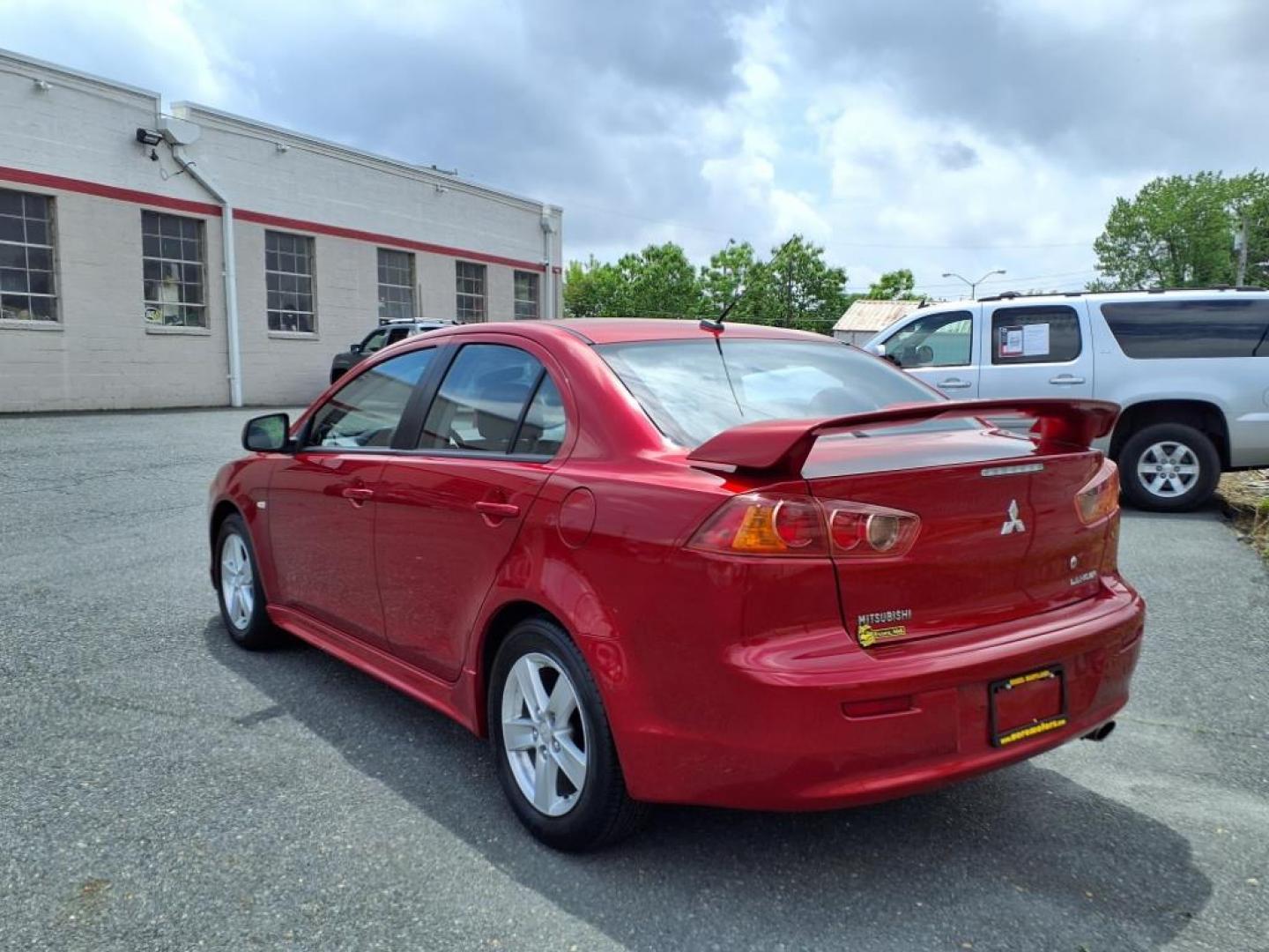 2009 Rally Red Metallic Mitsubishi Lancer ES Sport (JA3AU26U29U) with an 2.0L 2.0L I4 152hp 146ft. lbs. Sequential-Port F.I. engine, CVT transmission, located at 50 Eastern Blvd., Essex, MD, 21221, (410) 686-3444, 39.304367, -76.484947 - Photo#2