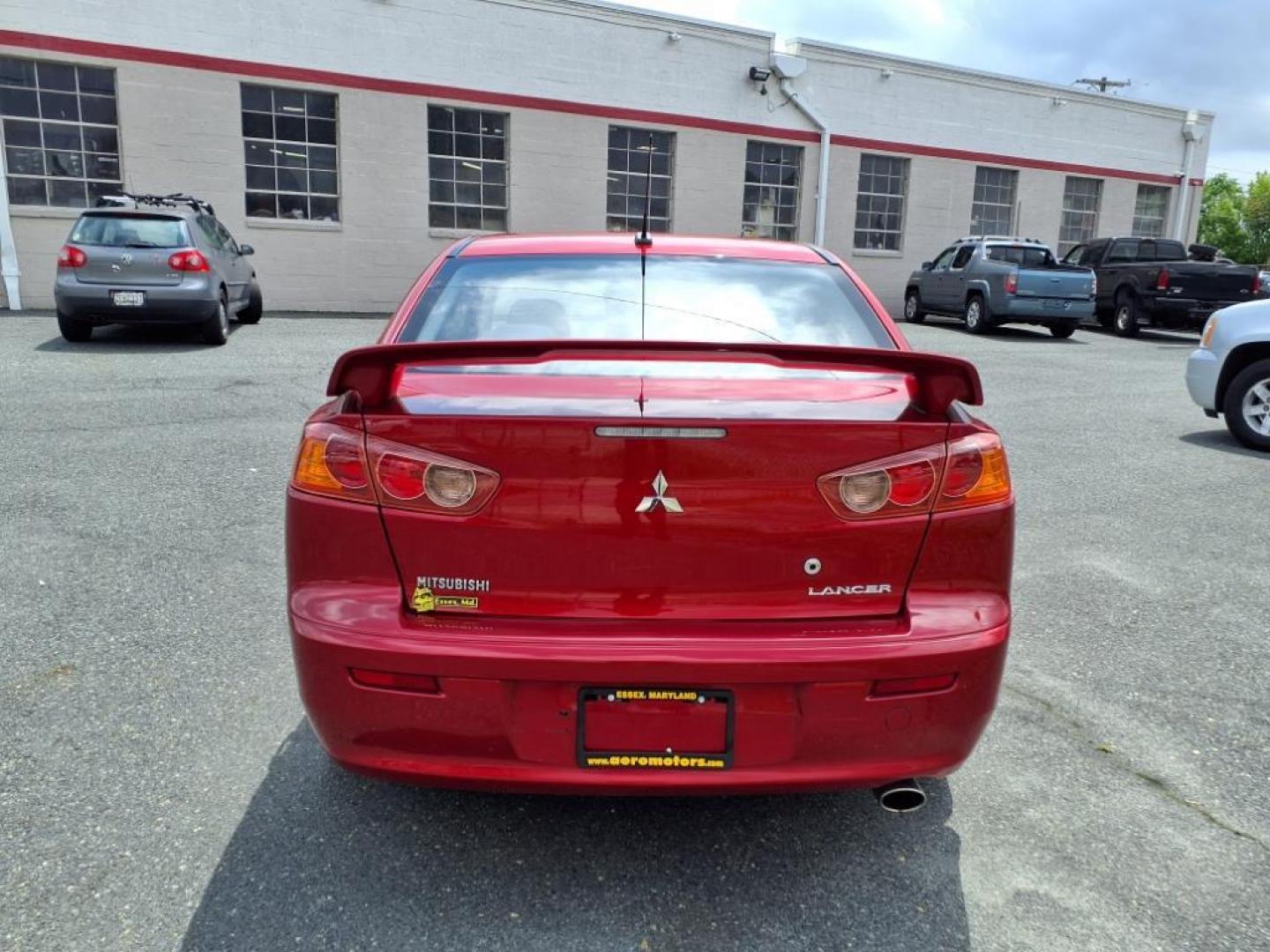 2009 Rally Red Metallic Mitsubishi Lancer ES Sport (JA3AU26U29U) with an 2.0L 2.0L I4 152hp 146ft. lbs. Sequential-Port F.I. engine, CVT transmission, located at 50 Eastern Blvd., Essex, MD, 21221, (410) 686-3444, 39.304367, -76.484947 - Photo#3