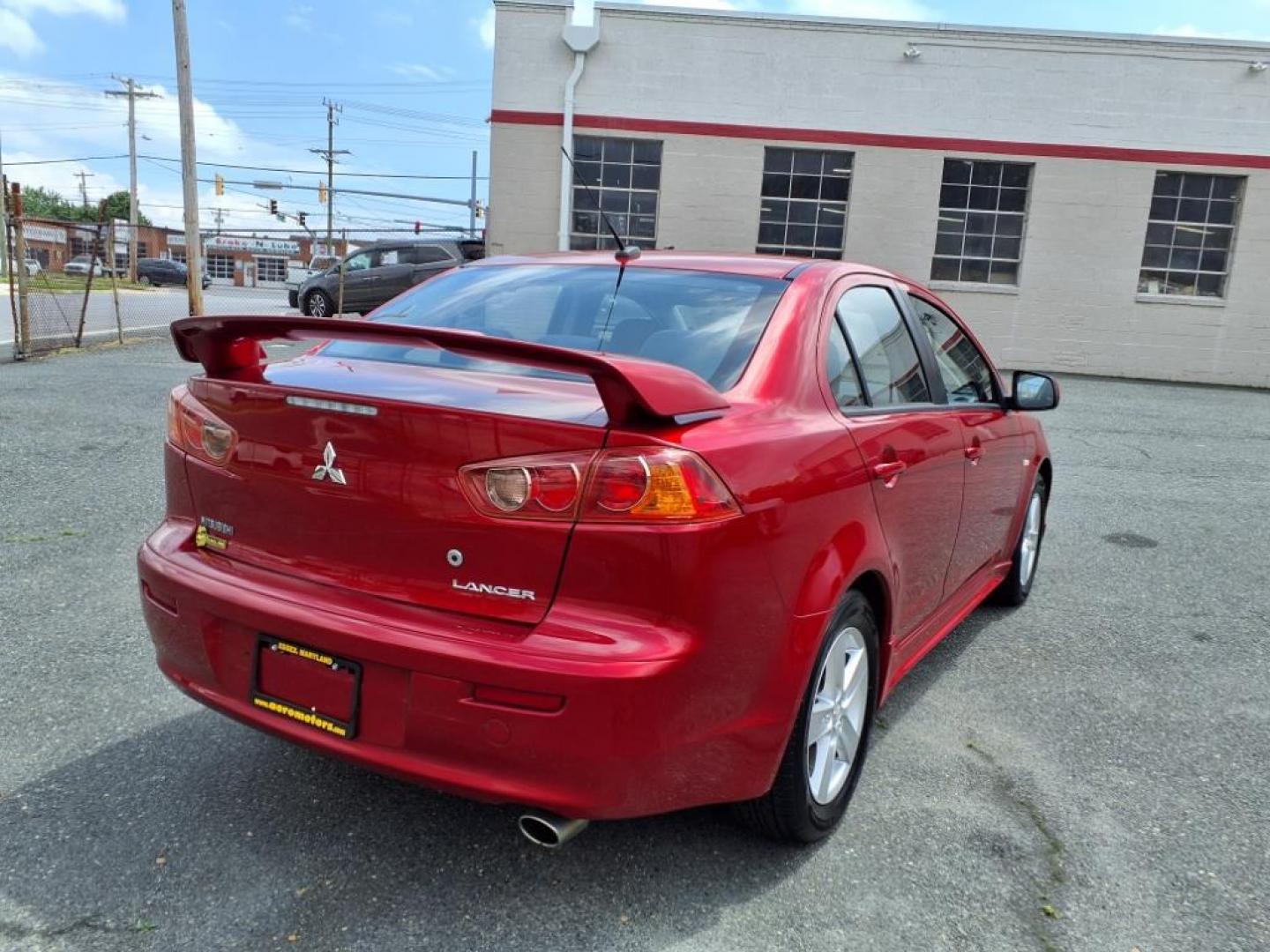 2009 Rally Red Metallic Mitsubishi Lancer ES Sport (JA3AU26U29U) with an 2.0L 2.0L I4 152hp 146ft. lbs. Sequential-Port F.I. engine, CVT transmission, located at 50 Eastern Blvd., Essex, MD, 21221, (410) 686-3444, 39.304367, -76.484947 - Photo#4