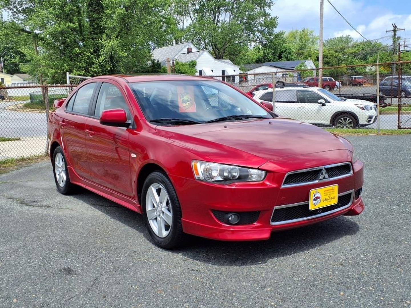 2009 Rally Red Metallic Mitsubishi Lancer ES Sport (JA3AU26U29U) with an 2.0L 2.0L I4 152hp 146ft. lbs. Sequential-Port F.I. engine, CVT transmission, located at 50 Eastern Blvd., Essex, MD, 21221, (410) 686-3444, 39.304367, -76.484947 - Photo#6