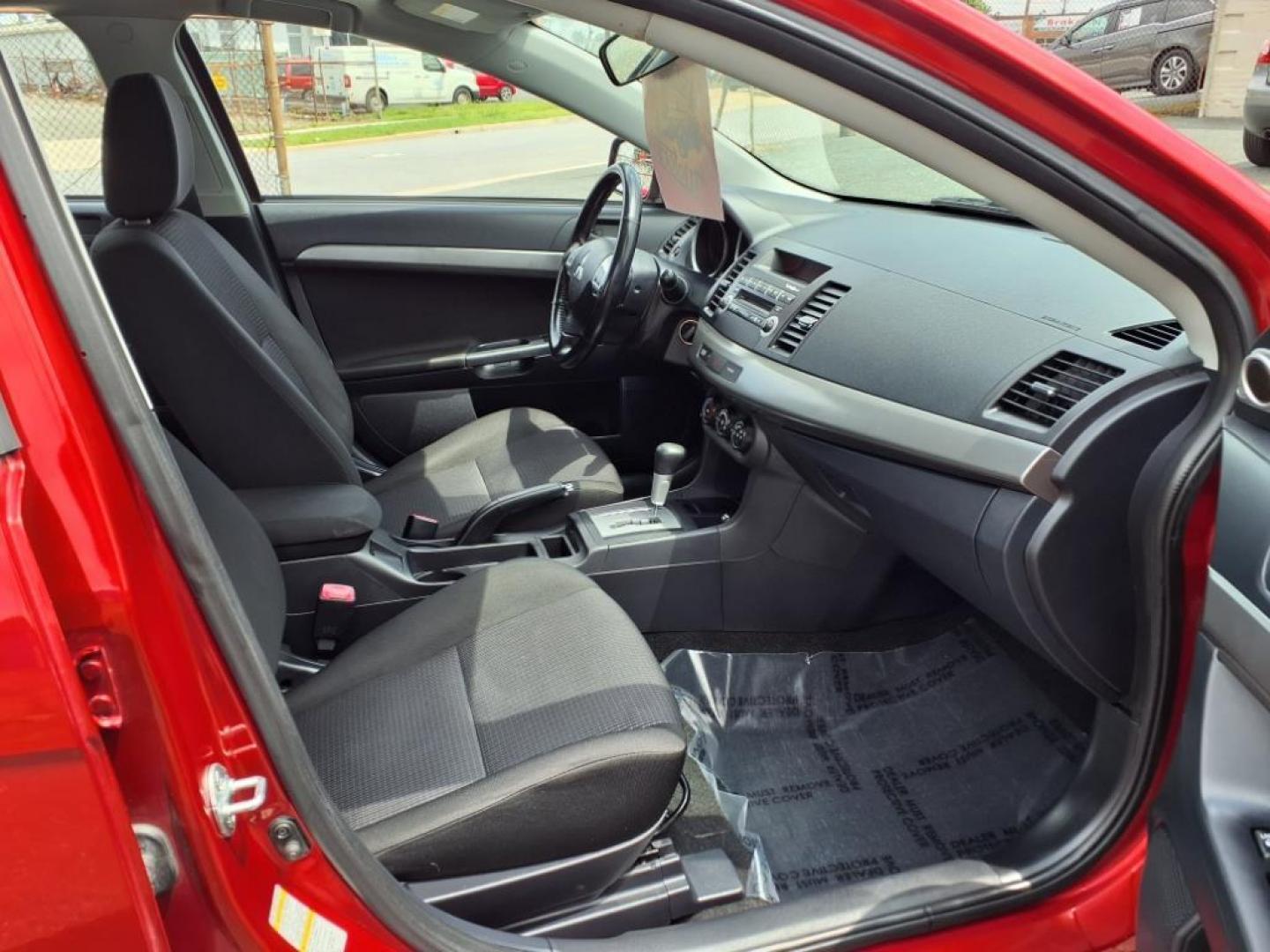 2009 Rally Red Metallic Mitsubishi Lancer ES Sport (JA3AU26U29U) with an 2.0L 2.0L I4 152hp 146ft. lbs. Sequential-Port F.I. engine, CVT transmission, located at 50 Eastern Blvd., Essex, MD, 21221, (410) 686-3444, 39.304367, -76.484947 - Photo#17