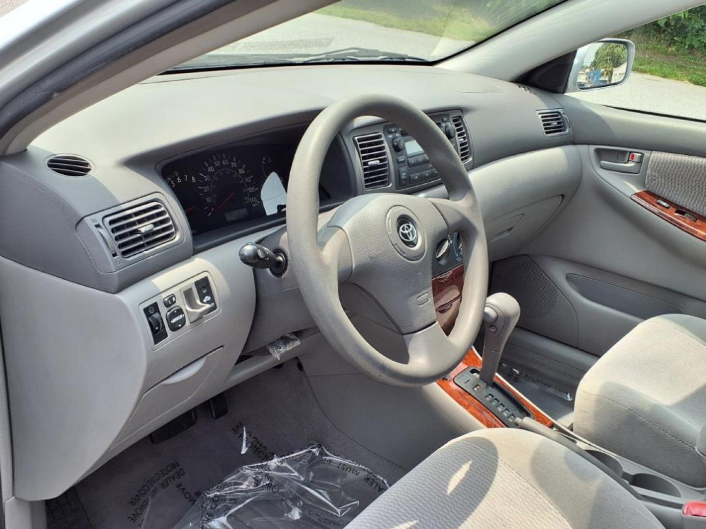 2006 Silver Streak Mica Toyota Corolla LE (JTDBR32E360) with an 1.8L 1L NA I4 double overhead cam (DOHC) 16V Fuel Injected engine, 4-Speed Automatic transmission, located at 50 Eastern Blvd., Essex, MD, 21221, (410) 686-3444, 39.304367, -76.484947 - Photo#5
