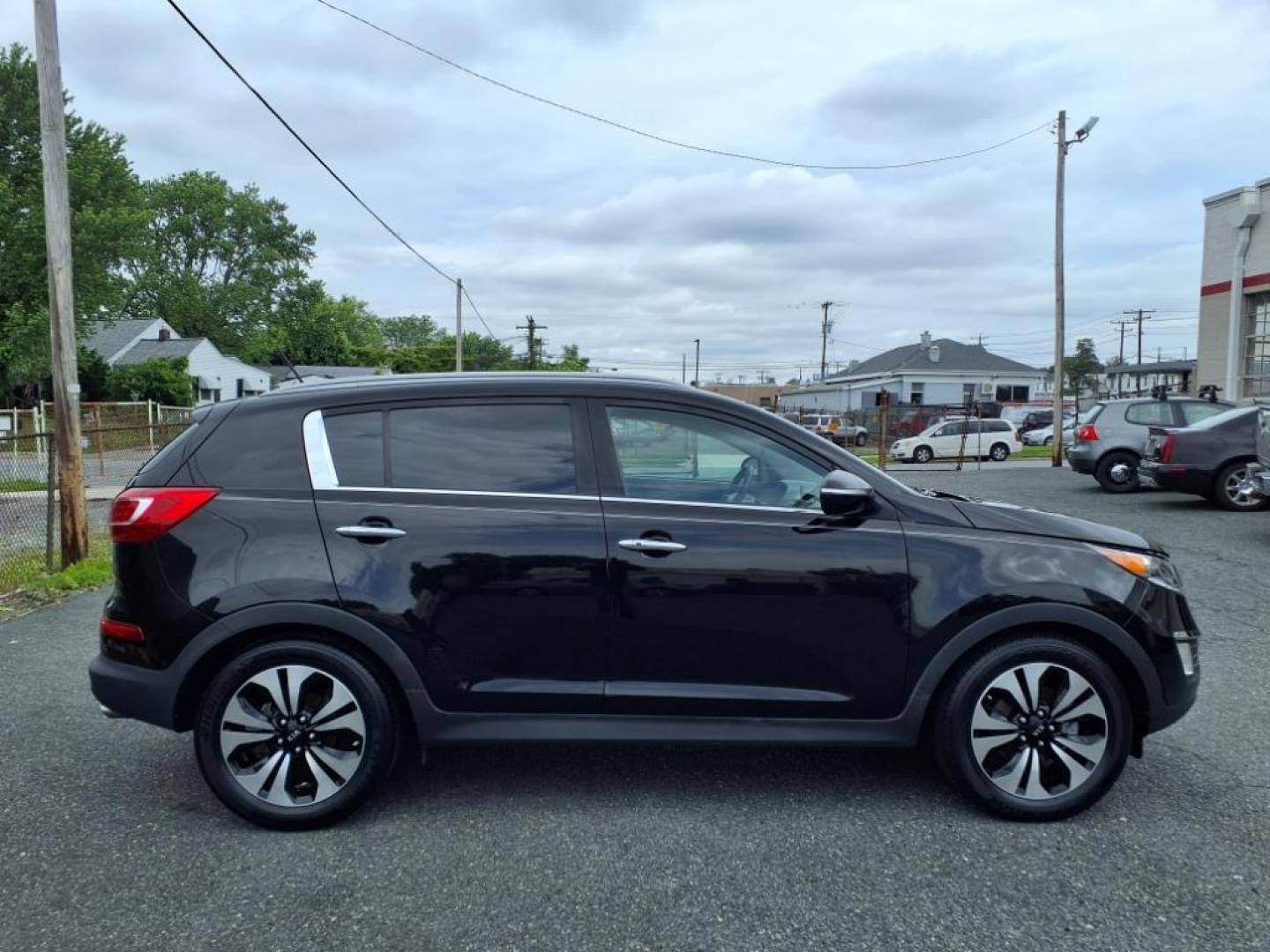 2012 Black Kia Sportage SX (KNDPC3A68C7) with an 2.0L 2.0L Turbo I4 260hp 269ft. lbs. Turbocharged engine, 6-Speed Automatic Sportmatic transmission, located at 50 Eastern Blvd., Essex, MD, 21221, (410) 686-3444, 39.304367, -76.484947 - Photo#6