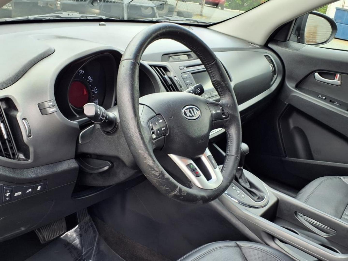 2012 Black Kia Sportage SX (KNDPC3A68C7) with an 2.0L 2.0L Turbo I4 260hp 269ft. lbs. Turbocharged engine, 6-Speed Automatic Sportmatic transmission, located at 50 Eastern Blvd., Essex, MD, 21221, (410) 686-3444, 39.304367, -76.484947 - Photo#11