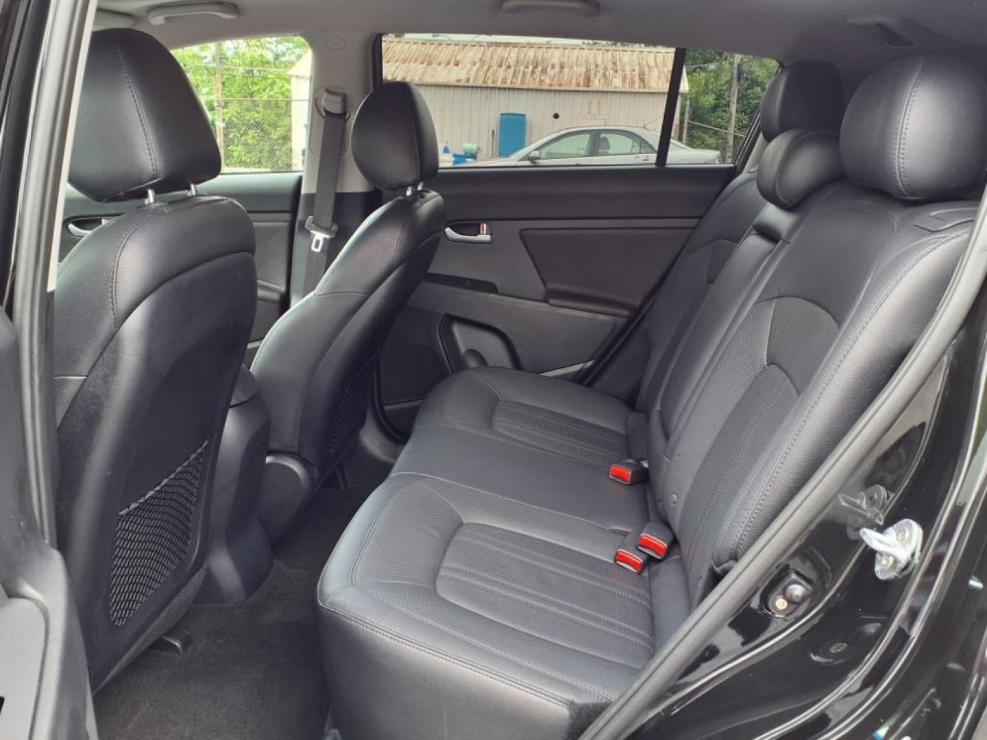 2012 Black Kia Sportage SX (KNDPC3A68C7) with an 2.0L 2.0L Turbo I4 260hp 269ft. lbs. Turbocharged engine, 6-Speed Automatic Sportmatic transmission, located at 50 Eastern Blvd., Essex, MD, 21221, (410) 686-3444, 39.304367, -76.484947 - Photo#13
