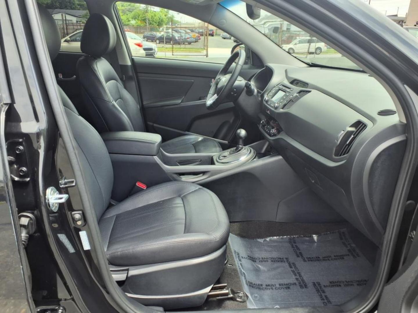2012 Black Kia Sportage SX (KNDPC3A68C7) with an 2.0L 2.0L Turbo I4 260hp 269ft. lbs. Turbocharged engine, 6-Speed Automatic Sportmatic transmission, located at 50 Eastern Blvd., Essex, MD, 21221, (410) 686-3444, 39.304367, -76.484947 - Photo#18