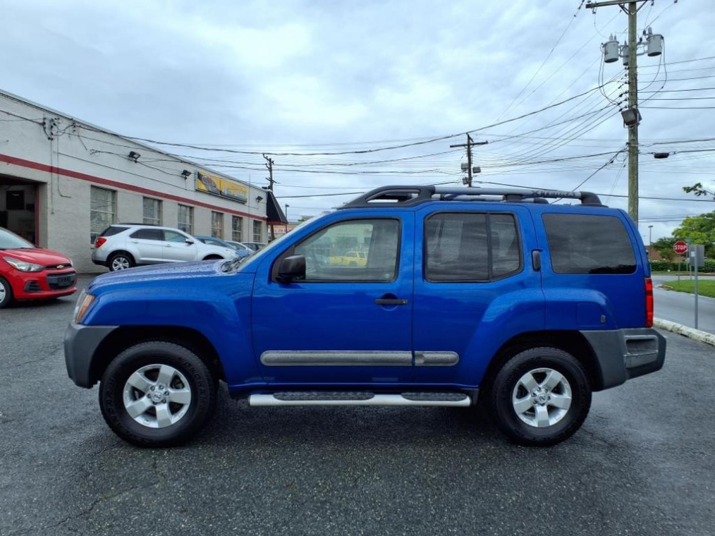2012 Metallic Blue Nissan Xterra S (5N1AN0NU7CN) with an 4.0L 4.0L V6 261hp 281ft. lbs. Fuel Injected engine, 5-Speed Automatic transmission, located at 50 Eastern Blvd., Essex, MD, 21221, (410) 686-3444, 39.304367, -76.484947 - Photo#1