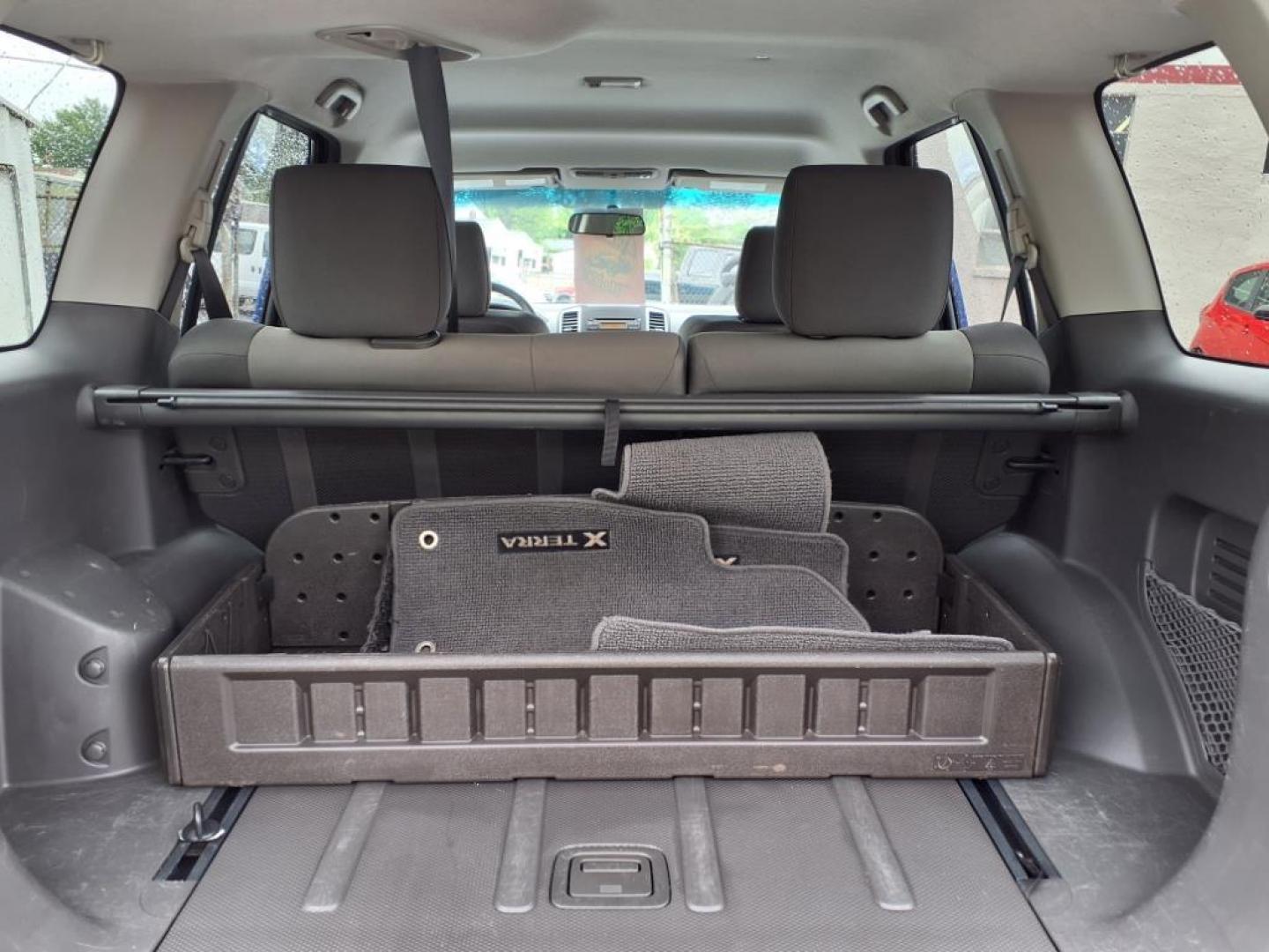 2012 Metallic Blue Nissan Xterra S (5N1AN0NU7CN) with an 4.0L 4.0L V6 261hp 281ft. lbs. Fuel Injected engine, 5-Speed Automatic transmission, located at 50 Eastern Blvd., Essex, MD, 21221, (410) 686-3444, 39.304367, -76.484947 - Photo#4