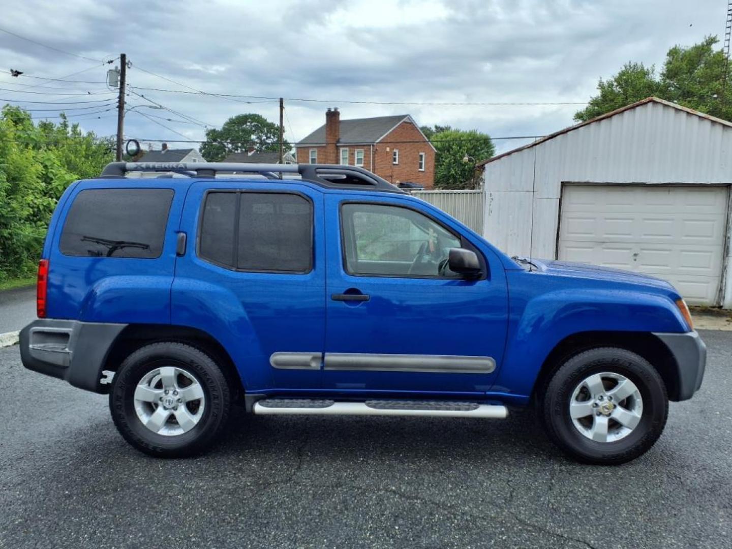 2012 Metallic Blue Nissan Xterra S (5N1AN0NU7CN) with an 4.0L 4.0L V6 261hp 281ft. lbs. Fuel Injected engine, 5-Speed Automatic transmission, located at 50 Eastern Blvd., Essex, MD, 21221, (410) 686-3444, 39.304367, -76.484947 - Photo#6