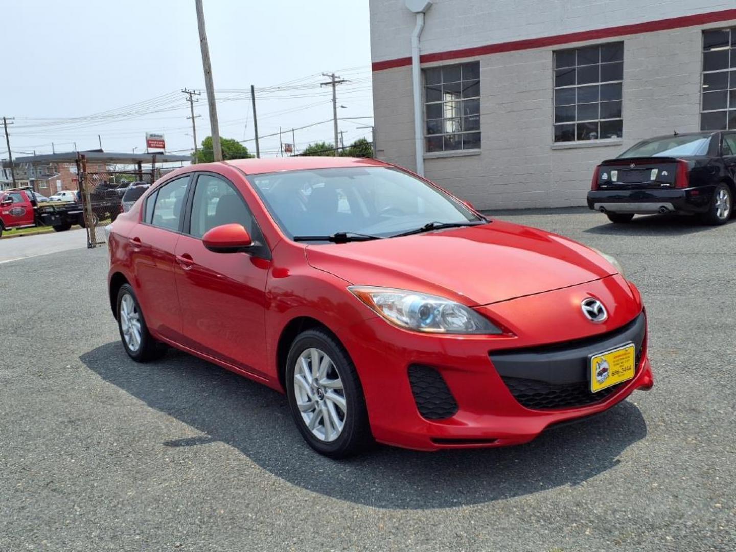 2013 Velocity Red Mazda Mazda3 i Touring (JM1BL1VPXD1) with an 2.0L SKYACTIV-G 2.0L I4 155hp 148ft. lbs. Sequential-Port F.I. engine, 6-Speed Shiftable Automatic transmission, located at 50 Eastern Blvd., Essex, MD, 21221, (410) 686-3444, 39.304367, -76.484947 - Photo#6