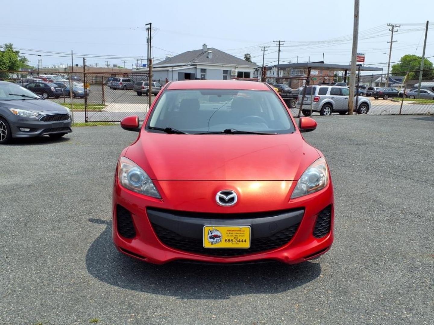 2013 Velocity Red Mazda Mazda3 i Touring (JM1BL1VPXD1) with an 2.0L SKYACTIV-G 2.0L I4 155hp 148ft. lbs. Sequential-Port F.I. engine, 6-Speed Shiftable Automatic transmission, located at 50 Eastern Blvd., Essex, MD, 21221, (410) 686-3444, 39.304367, -76.484947 - Photo#7