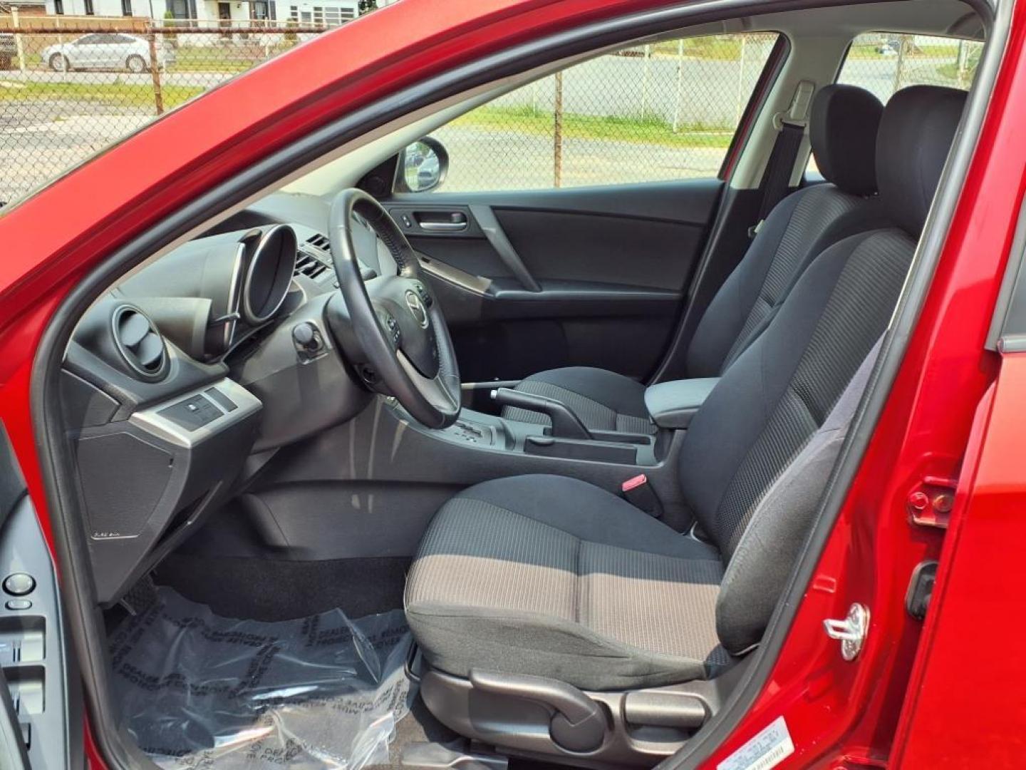 2013 Velocity Red Mazda Mazda3 i Touring (JM1BL1VPXD1) with an 2.0L SKYACTIV-G 2.0L I4 155hp 148ft. lbs. Sequential-Port F.I. engine, 6-Speed Shiftable Automatic transmission, located at 50 Eastern Blvd., Essex, MD, 21221, (410) 686-3444, 39.304367, -76.484947 - Photo#11