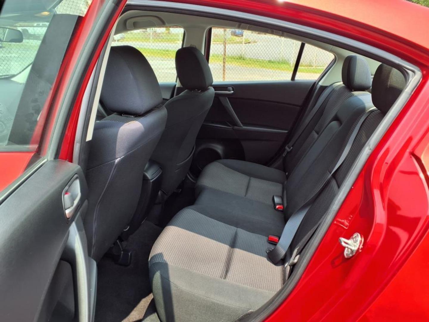 2013 Velocity Red Mazda Mazda3 i Touring (JM1BL1VPXD1) with an 2.0L SKYACTIV-G 2.0L I4 155hp 148ft. lbs. Sequential-Port F.I. engine, 6-Speed Shiftable Automatic transmission, located at 50 Eastern Blvd., Essex, MD, 21221, (410) 686-3444, 39.304367, -76.484947 - Photo#12