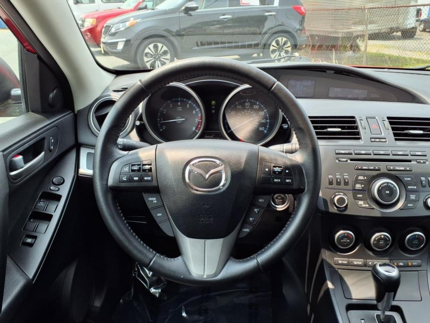 2013 Velocity Red Mazda Mazda3 i Touring (JM1BL1VPXD1) with an 2.0L SKYACTIV-G 2.0L I4 155hp 148ft. lbs. Sequential-Port F.I. engine, 6-Speed Shiftable Automatic transmission, located at 50 Eastern Blvd., Essex, MD, 21221, (410) 686-3444, 39.304367, -76.484947 - Photo#13