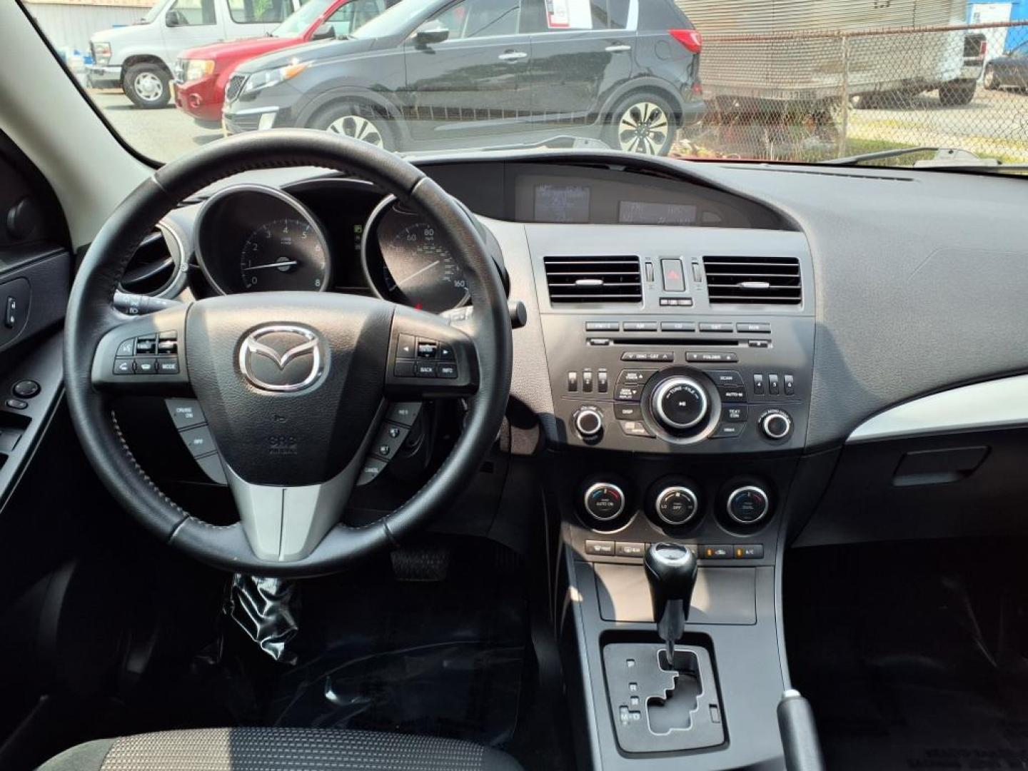 2013 Velocity Red Mazda Mazda3 i Touring (JM1BL1VPXD1) with an 2.0L SKYACTIV-G 2.0L I4 155hp 148ft. lbs. Sequential-Port F.I. engine, 6-Speed Shiftable Automatic transmission, located at 50 Eastern Blvd., Essex, MD, 21221, (410) 686-3444, 39.304367, -76.484947 - Photo#14