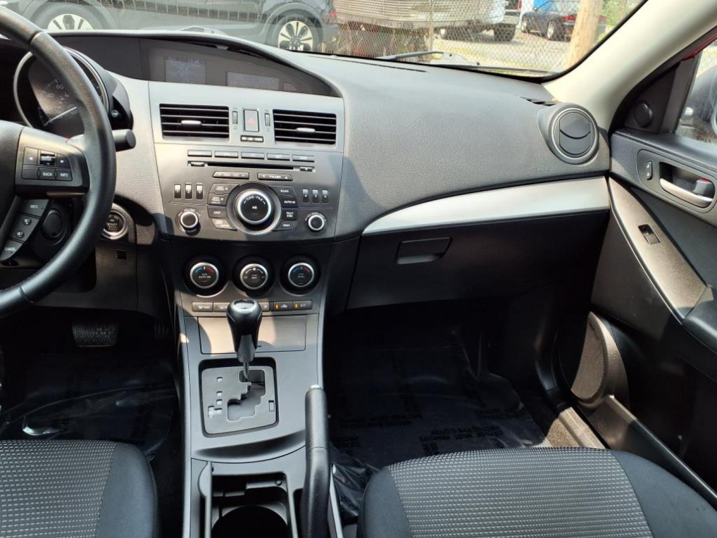 2013 Velocity Red Mazda Mazda3 i Touring (JM1BL1VPXD1) with an 2.0L SKYACTIV-G 2.0L I4 155hp 148ft. lbs. Sequential-Port F.I. engine, 6-Speed Shiftable Automatic transmission, located at 50 Eastern Blvd., Essex, MD, 21221, (410) 686-3444, 39.304367, -76.484947 - Photo#15