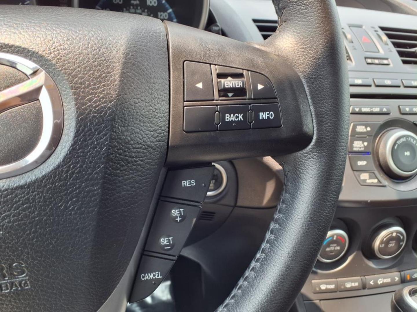 2013 Velocity Red Mazda Mazda3 i Touring (JM1BL1VPXD1) with an 2.0L SKYACTIV-G 2.0L I4 155hp 148ft. lbs. Sequential-Port F.I. engine, 6-Speed Shiftable Automatic transmission, located at 50 Eastern Blvd., Essex, MD, 21221, (410) 686-3444, 39.304367, -76.484947 - Photo#21