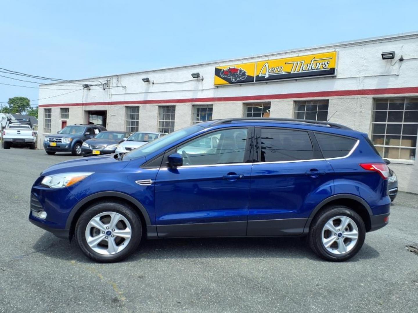 2016 Deep Impact Blue Ford Escape SE (1FMCU0GX7GU) with an 1.6L EcoBoost 1.6L Turbo I4 178hp 184ft. lbs. Turbocharged engine, 6-Speed Shiftable Automatic transmission, located at 50 Eastern Blvd., Essex, MD, 21221, (410) 686-3444, 39.304367, -76.484947 - Photo#1