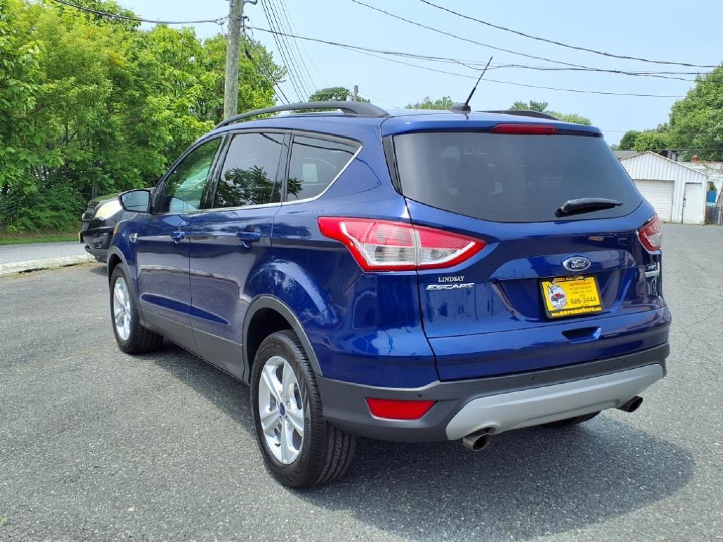 2016 Deep Impact Blue Ford Escape SE (1FMCU0GX7GU) with an 1.6L EcoBoost 1.6L Turbo I4 178hp 184ft. lbs. Turbocharged engine, 6-Speed Shiftable Automatic transmission, located at 50 Eastern Blvd., Essex, MD, 21221, (410) 686-3444, 39.304367, -76.484947 - Photo#2