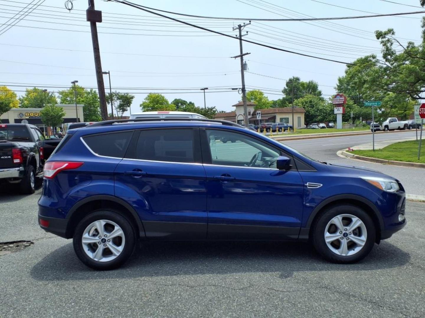 2016 Deep Impact Blue Ford Escape SE (1FMCU0GX7GU) with an 1.6L EcoBoost 1.6L Turbo I4 178hp 184ft. lbs. Turbocharged engine, 6-Speed Shiftable Automatic transmission, located at 50 Eastern Blvd., Essex, MD, 21221, (410) 686-3444, 39.304367, -76.484947 - Photo#6