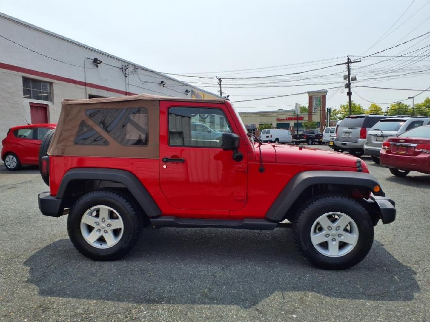 2017 Firecracker Red Clear Coat Jeep Wrangler Sport (1C4GJWAG3HL) with an 3.6L 3.6L V6 285hp 260ft. lbs. Sequential-Port F.I. engine, Automatic transmission, located at 50 Eastern Blvd., Essex, MD, 21221, (410) 686-3444, 39.304367, -76.484947 - Photo#6