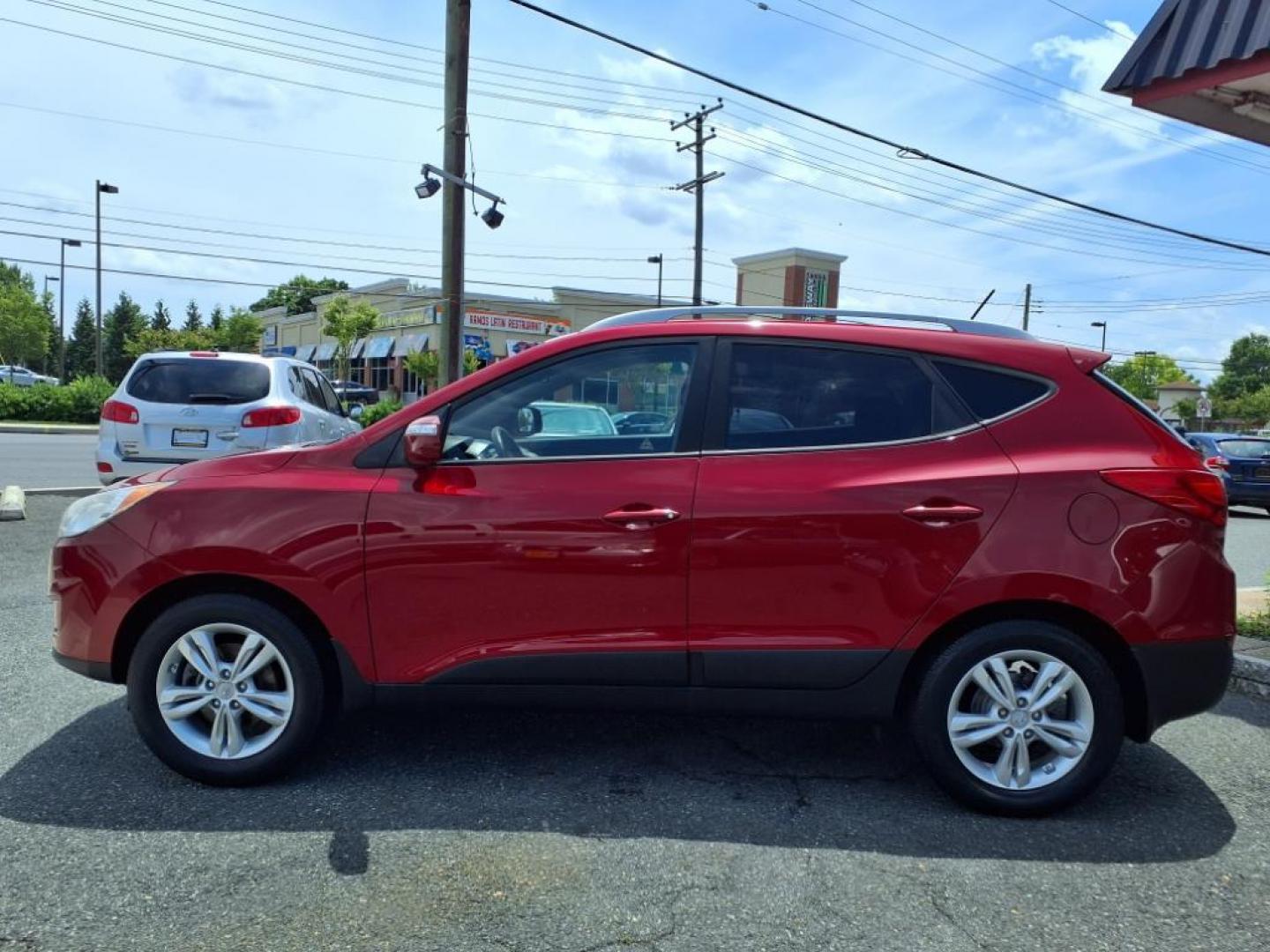 2013 Garnet Red Mica Hyundai TUCSON Limited (KM8JU3AC6DU) with an 2.4L 2.4L I4 176hp 168ft. lbs. Sequential-Port F.I. engine, 6-Speed Shiftable Automatic transmission, located at 50 Eastern Blvd., Essex, MD, 21221, (410) 686-3444, 39.304367, -76.484947 - Photo#1