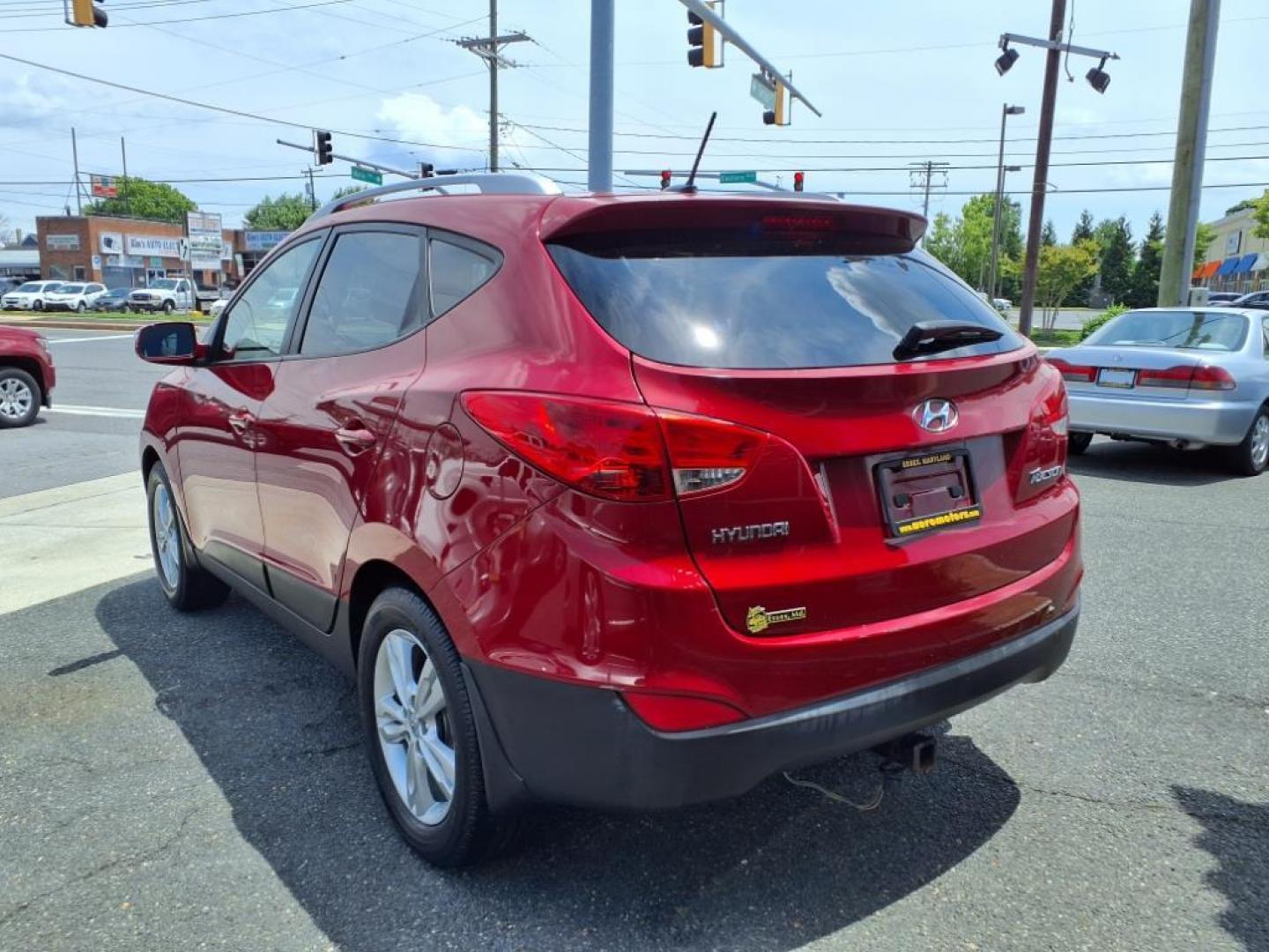 2013 Garnet Red Mica Hyundai TUCSON Limited (KM8JU3AC6DU) with an 2.4L 2.4L I4 176hp 168ft. lbs. Sequential-Port F.I. engine, 6-Speed Shiftable Automatic transmission, located at 50 Eastern Blvd., Essex, MD, 21221, (410) 686-3444, 39.304367, -76.484947 - Photo#2