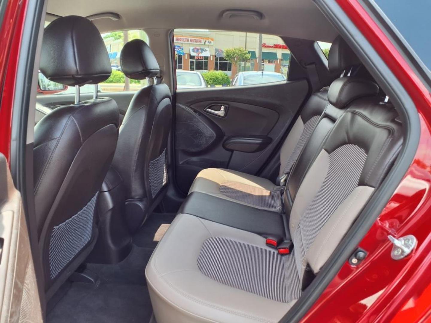 2013 Garnet Red Mica Hyundai TUCSON Limited (KM8JU3AC6DU) with an 2.4L 2.4L I4 176hp 168ft. lbs. Sequential-Port F.I. engine, 6-Speed Shiftable Automatic transmission, located at 50 Eastern Blvd., Essex, MD, 21221, (410) 686-3444, 39.304367, -76.484947 - Photo#12