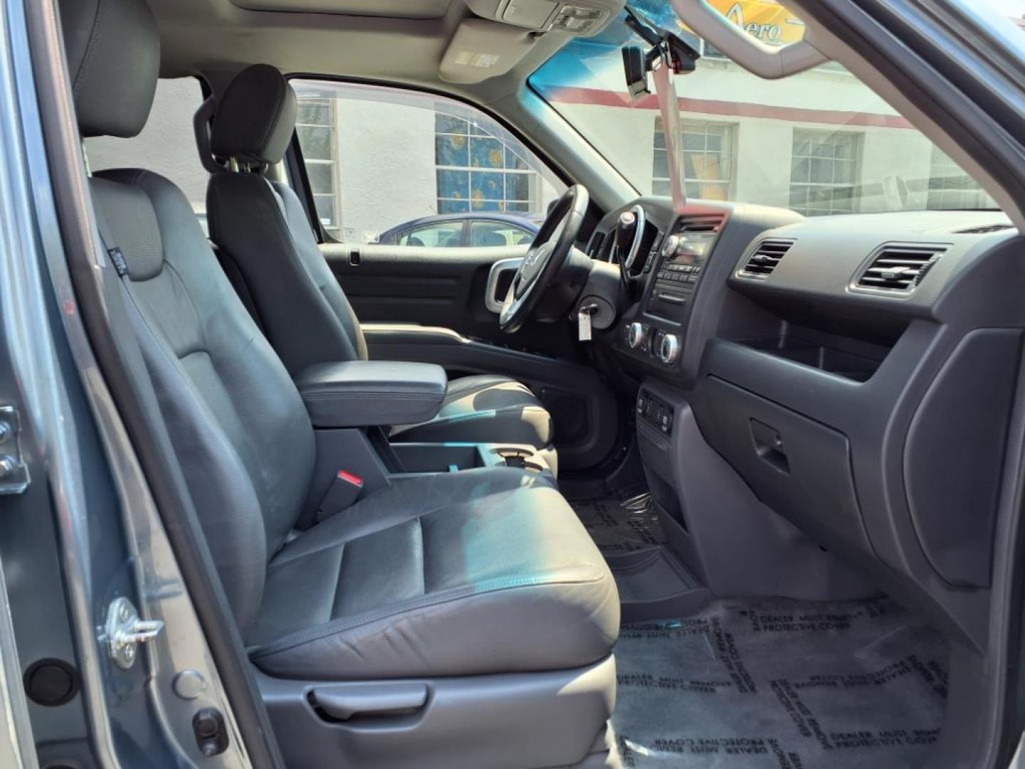2008 Steel Blue Metallic Honda Ridgeline RTL (2HJYK16568H) with an 3.5L 3.5L V6 247hp 245ft. lbs. Sequential-Port F.I. engine, 5-Speed Automatic transmission, located at 50 Eastern Blvd., Essex, MD, 21221, (410) 686-3444, 39.304367, -76.484947 - Photo#15