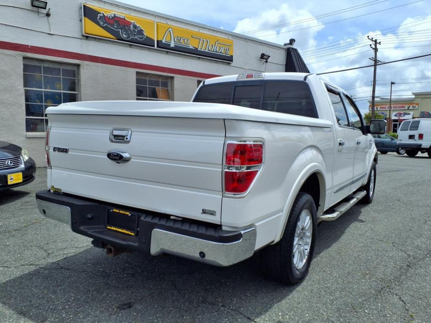 2010 Oxford White Ford F-150 Lariat (1FTFW1CV8AF) with an 5.4L Triton 5.4L Flex Fuel V8 320hp 390ft. lbs. Sequential-Port F.I. engine, 6-Speed Automatic transmission, located at 50 Eastern Blvd., Essex, MD, 21221, (410) 686-3444, 39.304367, -76.484947 - Photo#4