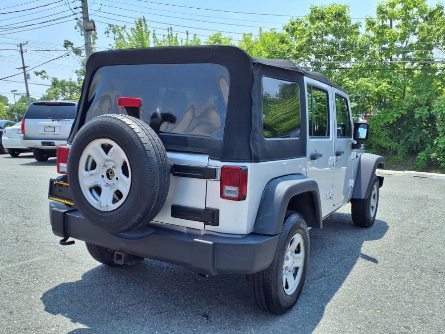 2011 Silver Jeep Wrangler Unlimited (1J4BA3H17BL) with an 3.8L 6 Cylinder Sequential-Port F.I. engine, V6 transmission, located at 50 Eastern Blvd., Essex, MD, 21221, (410) 686-3444, 39.304367, -76.484947 - Photo#5