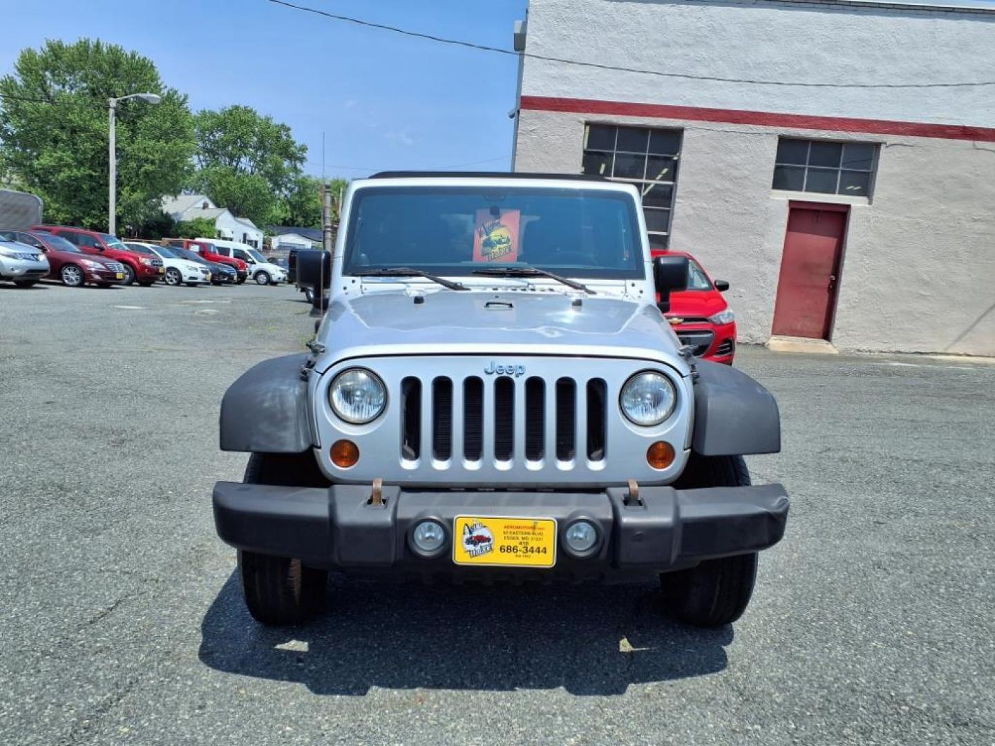 2011 Silver Jeep Wrangler Unlimited (1J4BA3H17BL) with an 3.8L 6 Cylinder Sequential-Port F.I. engine, V6 transmission, located at 50 Eastern Blvd., Essex, MD, 21221, (410) 686-3444, 39.304367, -76.484947 - Photo#8