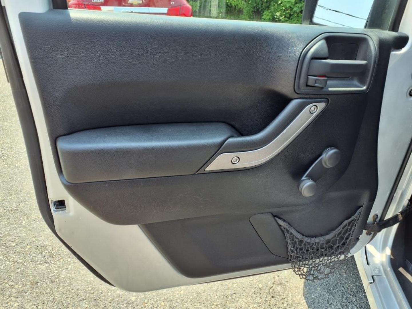 2011 Silver Jeep Wrangler Unlimited (1J4BA3H17BL) with an 3.8L 6 Cylinder Sequential-Port F.I. engine, V6 transmission, located at 50 Eastern Blvd., Essex, MD, 21221, (410) 686-3444, 39.304367, -76.484947 - Photo#9