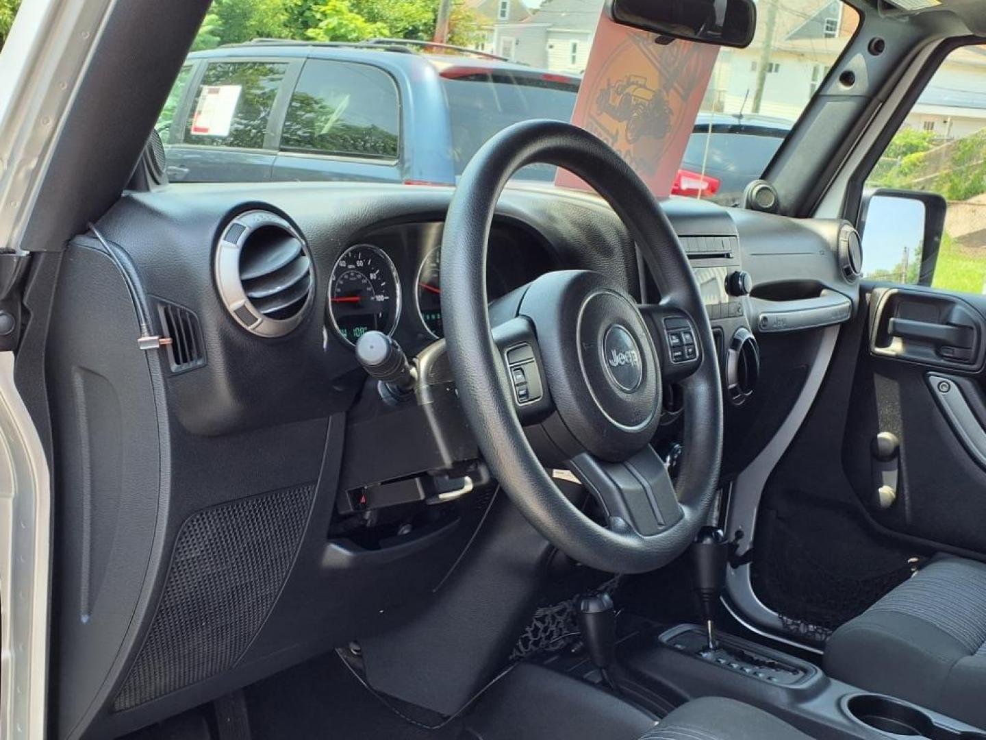 2011 Silver Jeep Wrangler Unlimited (1J4BA3H17BL) with an 3.8L 6 Cylinder Sequential-Port F.I. engine, V6 transmission, located at 50 Eastern Blvd., Essex, MD, 21221, (410) 686-3444, 39.304367, -76.484947 - Photo#10