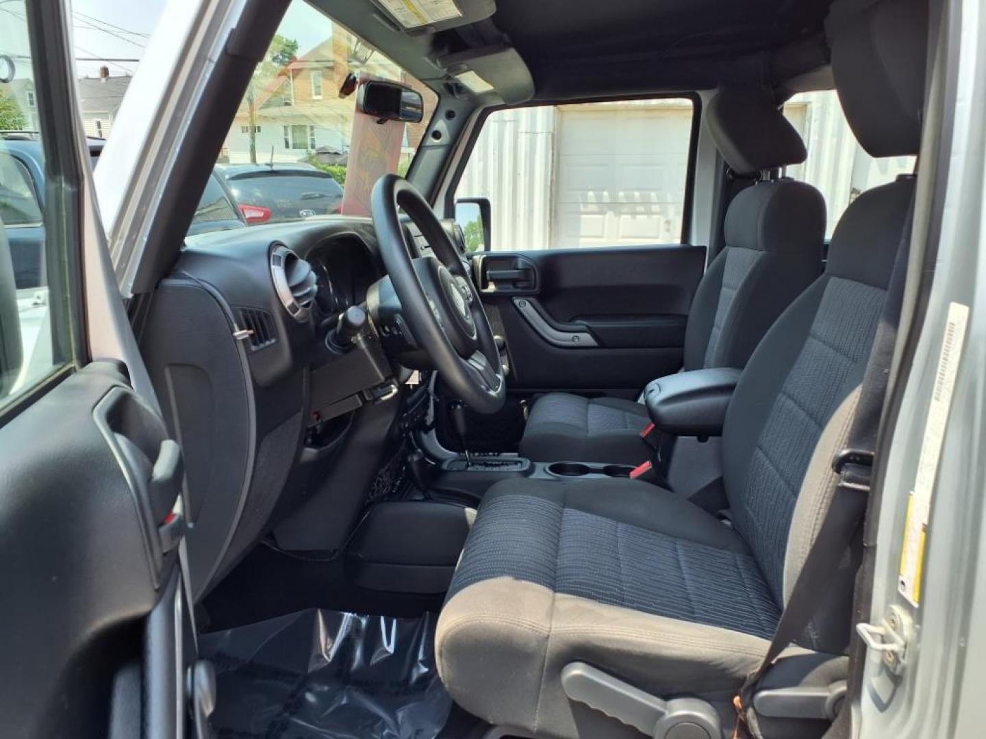 2011 Silver Jeep Wrangler Unlimited (1J4BA3H17BL) with an 3.8L 6 Cylinder Sequential-Port F.I. engine, V6 transmission, located at 50 Eastern Blvd., Essex, MD, 21221, (410) 686-3444, 39.304367, -76.484947 - Photo#11