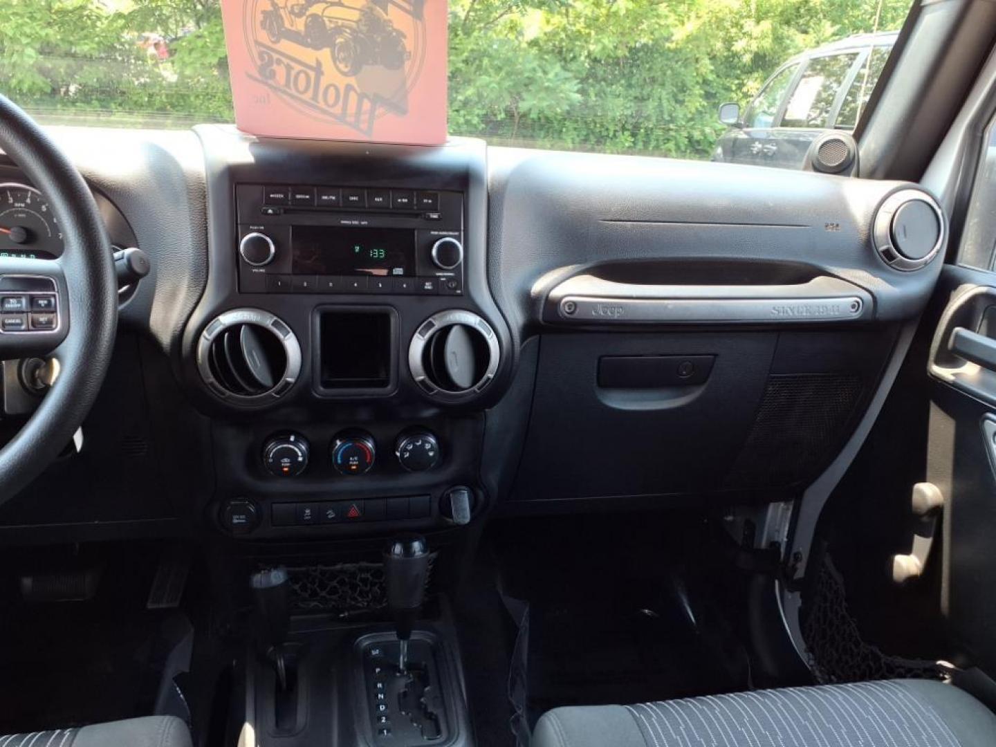 2011 Silver Jeep Wrangler Unlimited (1J4BA3H17BL) with an 3.8L 6 Cylinder Sequential-Port F.I. engine, V6 transmission, located at 50 Eastern Blvd., Essex, MD, 21221, (410) 686-3444, 39.304367, -76.484947 - Photo#15