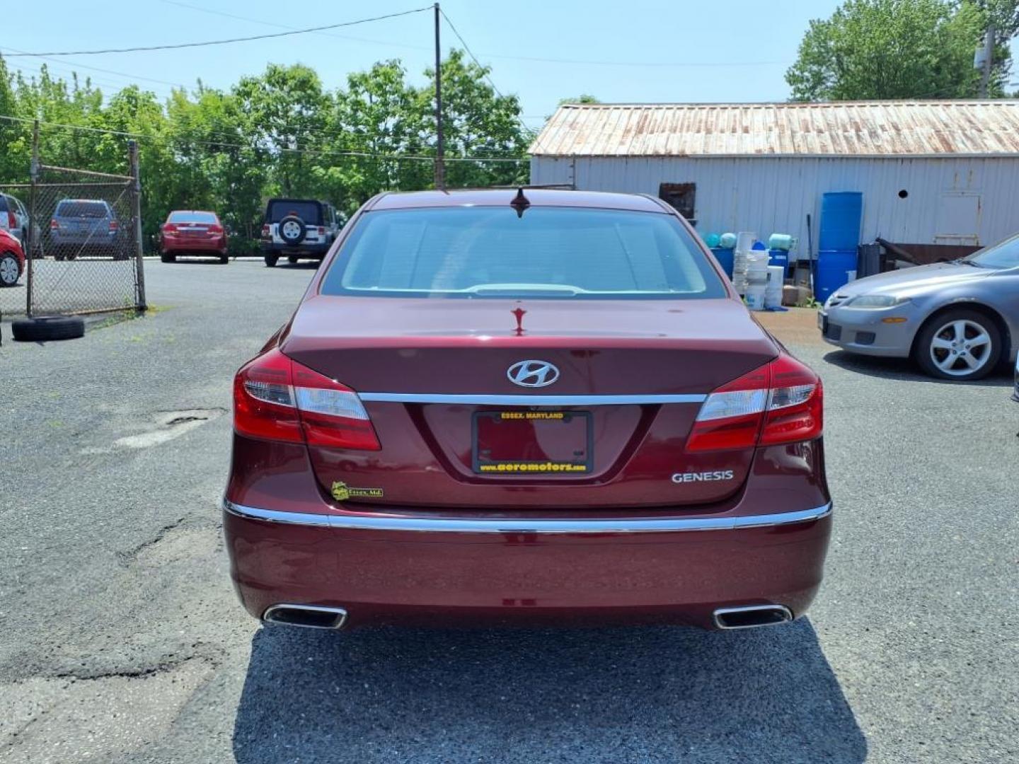 2013 Red Hyundai Genesis (KMHGC4DD2DU) with an 3.8L 6 Cylinder Fuel Injected engine, V6 transmission, located at 50 Eastern Blvd., Essex, MD, 21221, (410) 686-3444, 39.304367, -76.484947 - Photo#3