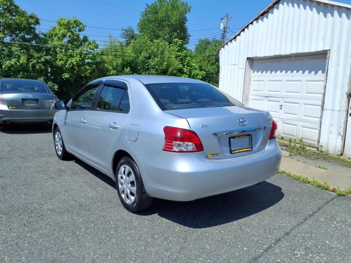 2009 Silver Streak Mica Toyota Yaris Base (JTDBT903591) with an 1.5L 1.5L I4 106hp 103ft. lbs. Sequential-Port F.I. engine, 4-Speed Automatic transmission, located at 50 Eastern Blvd., Essex, MD, 21221, (410) 686-3444, 39.304367, -76.484947 - Photo#2