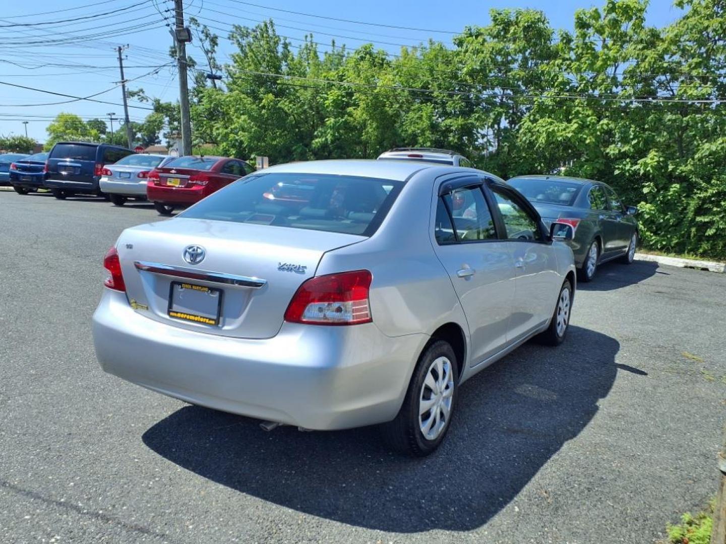 2009 Silver Streak Mica Toyota Yaris Base (JTDBT903591) with an 1.5L 1.5L I4 106hp 103ft. lbs. Sequential-Port F.I. engine, 4-Speed Automatic transmission, located at 50 Eastern Blvd., Essex, MD, 21221, (410) 686-3444, 39.304367, -76.484947 - Photo#4
