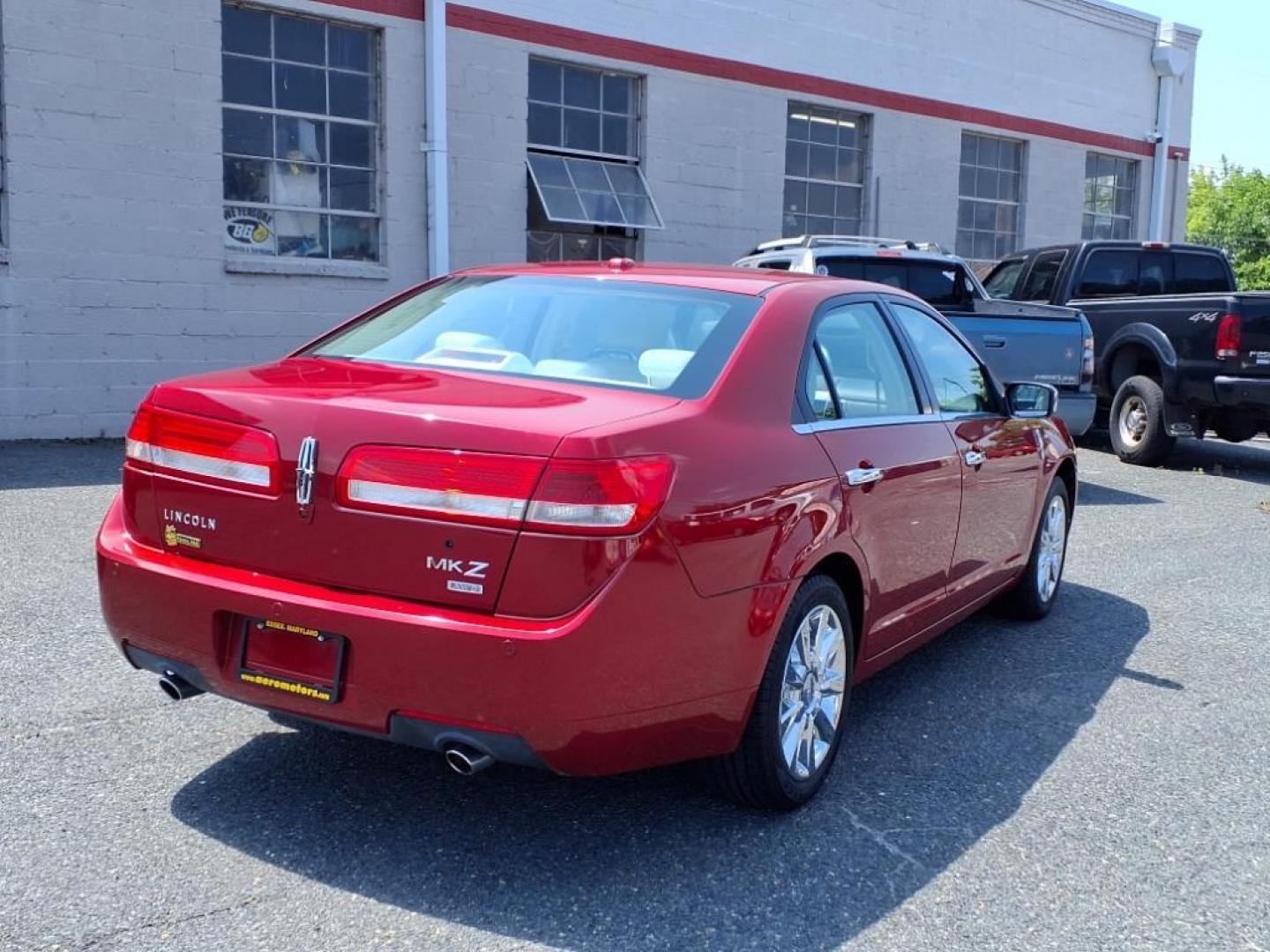 2010 Sangria Red Clearcoat Metallic Lincoln MKZ Base (3LNHL2JC6AR) with an 3.5L Duratec 3.5L V6 263hp 249ft. lbs. Sequential-Port F.I. engine, 6-Speed Shiftable Automatic transmission, located at 50 Eastern Blvd., Essex, MD, 21221, (410) 686-3444, 39.304367, -76.484947 - Photo#4