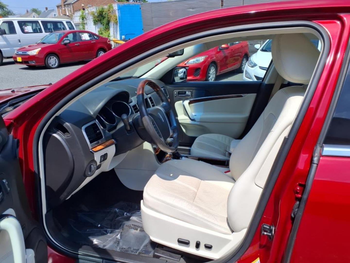2010 Sangria Red Clearcoat Metallic Lincoln MKZ Base (3LNHL2JC6AR) with an 3.5L Duratec 3.5L V6 263hp 249ft. lbs. Sequential-Port F.I. engine, 6-Speed Shiftable Automatic transmission, located at 50 Eastern Blvd., Essex, MD, 21221, (410) 686-3444, 39.304367, -76.484947 - Photo#11