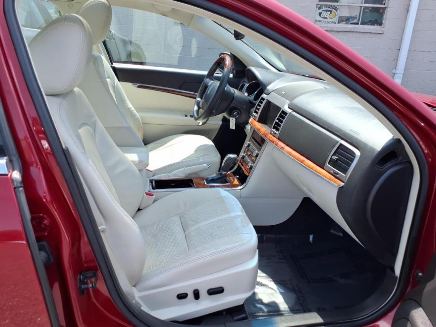 2010 Sangria Red Clearcoat Metallic Lincoln MKZ Base (3LNHL2JC6AR) with an 3.5L Duratec 3.5L V6 263hp 249ft. lbs. Sequential-Port F.I. engine, 6-Speed Shiftable Automatic transmission, located at 50 Eastern Blvd., Essex, MD, 21221, (410) 686-3444, 39.304367, -76.484947 - Photo#17
