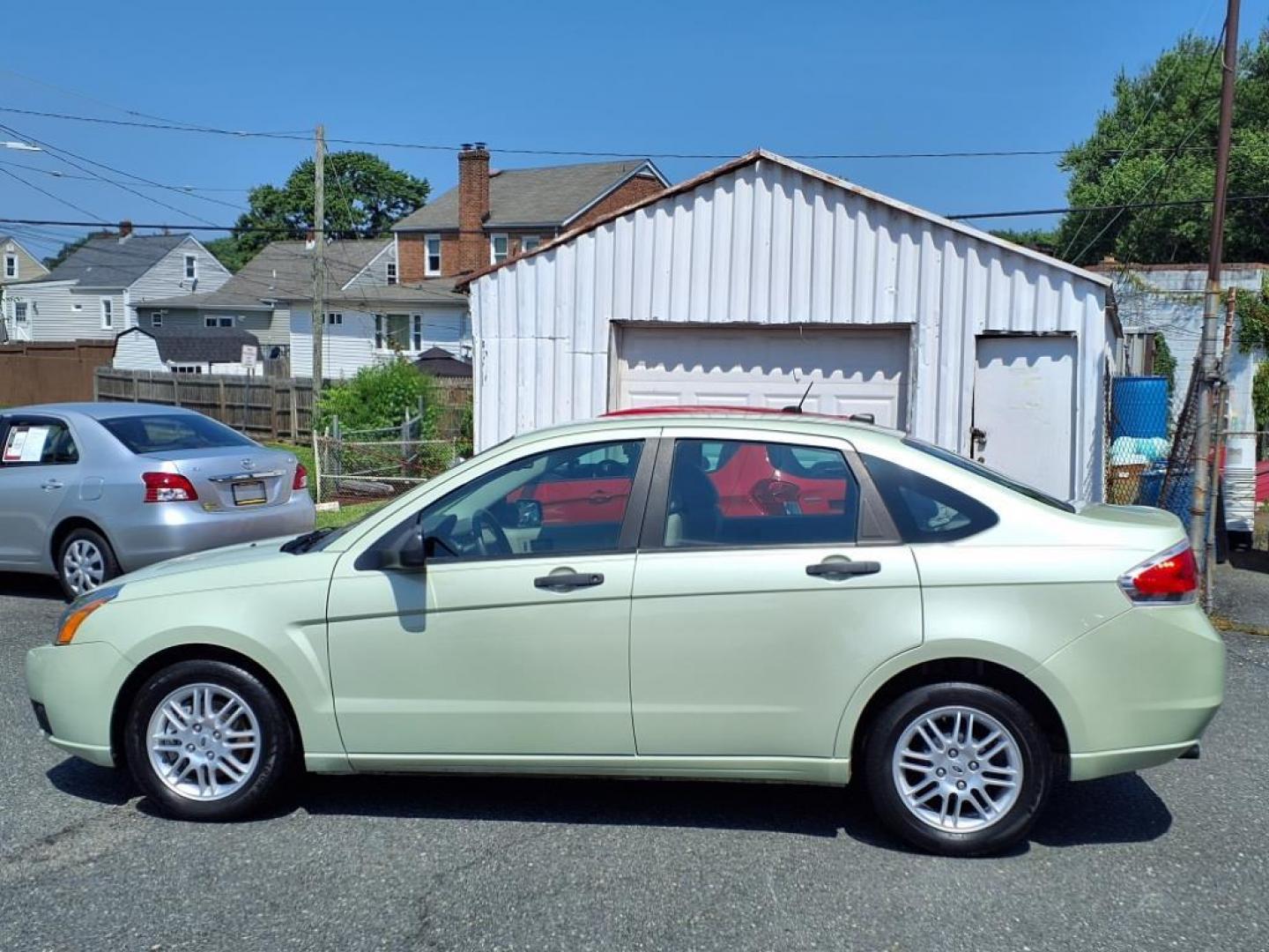 2010 Green Ford Focus SE (1FAHP3FN3AW) with an 2.0L 2.0L I4 140hp 136ft. lbs. Sequential-Port F.I. engine, Automatic transmission, located at 50 Eastern Blvd., Essex, MD, 21221, (410) 686-3444, 39.304367, -76.484947 - Photo#1