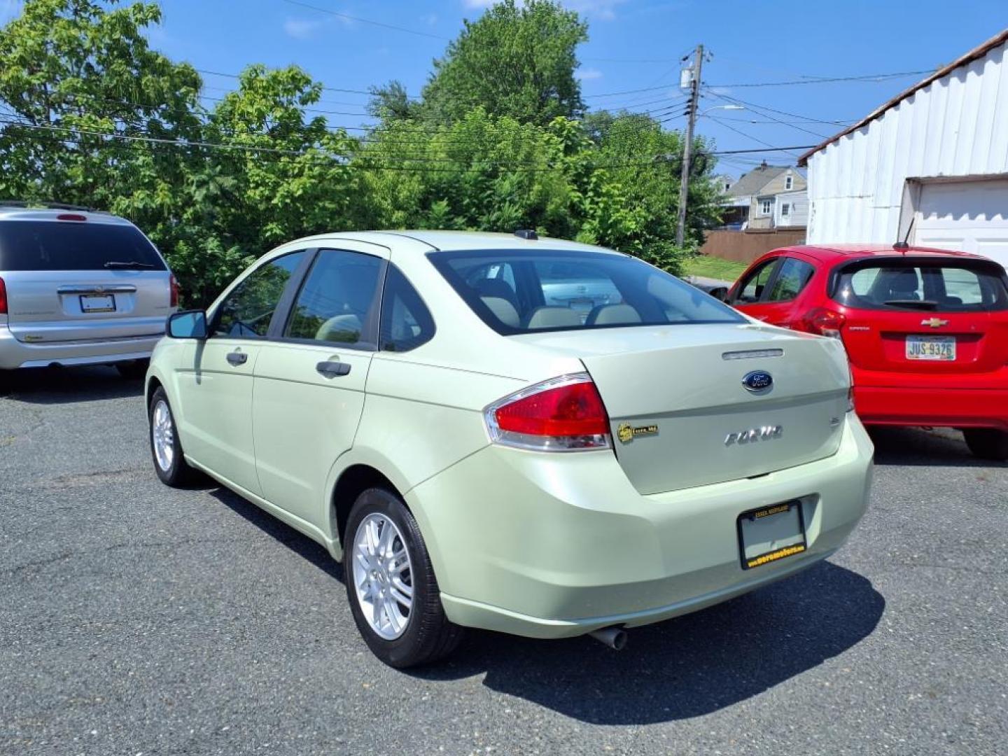 2010 Green Ford Focus SE (1FAHP3FN3AW) with an 2.0L 2.0L I4 140hp 136ft. lbs. Sequential-Port F.I. engine, Automatic transmission, located at 50 Eastern Blvd., Essex, MD, 21221, (410) 686-3444, 39.304367, -76.484947 - Photo#2