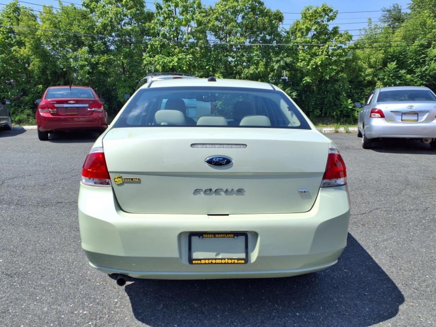 2010 Green Ford Focus SE (1FAHP3FN3AW) with an 2.0L 2.0L I4 140hp 136ft. lbs. Sequential-Port F.I. engine, Automatic transmission, located at 50 Eastern Blvd., Essex, MD, 21221, (410) 686-3444, 39.304367, -76.484947 - Photo#3