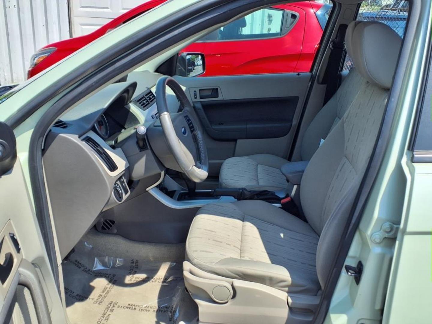 2010 Green Ford Focus SE (1FAHP3FN3AW) with an 2.0L 2.0L I4 140hp 136ft. lbs. Sequential-Port F.I. engine, Automatic transmission, located at 50 Eastern Blvd., Essex, MD, 21221, (410) 686-3444, 39.304367, -76.484947 - Photo#10