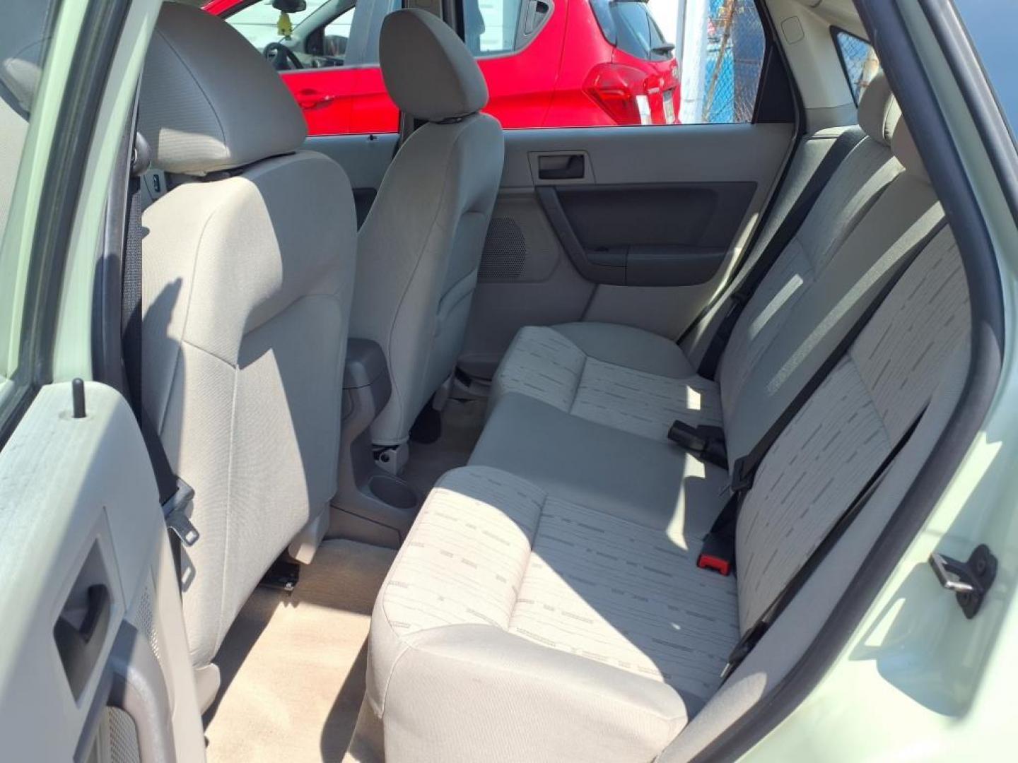 2010 Green Ford Focus SE (1FAHP3FN3AW) with an 2.0L 2.0L I4 140hp 136ft. lbs. Sequential-Port F.I. engine, Automatic transmission, located at 50 Eastern Blvd., Essex, MD, 21221, (410) 686-3444, 39.304367, -76.484947 - Photo#11
