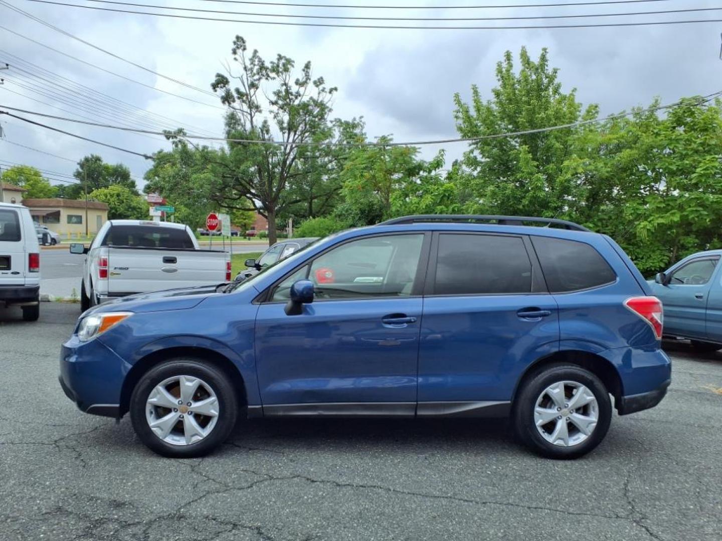 2014 Marine Blue Pearl Subaru Forester 2.5i Premium (JF2SJAEC4EH) with an 2.5L 2.5L H4 170hp 174ft. lbs. Sequential-Port F.I. engine, CVT transmission, located at 50 Eastern Blvd., Essex, MD, 21221, (410) 686-3444, 39.304367, -76.484947 - Photo#1