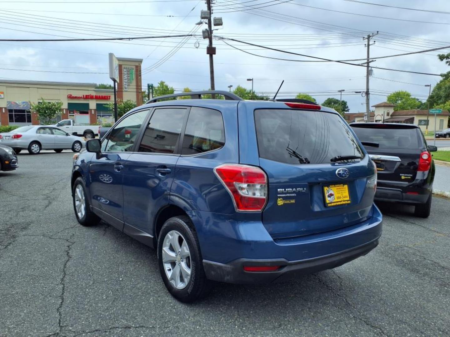 2014 Marine Blue Pearl Subaru Forester 2.5i Premium (JF2SJAEC4EH) with an 2.5L 2.5L H4 170hp 174ft. lbs. Sequential-Port F.I. engine, CVT transmission, located at 50 Eastern Blvd., Essex, MD, 21221, (410) 686-3444, 39.304367, -76.484947 - Photo#2