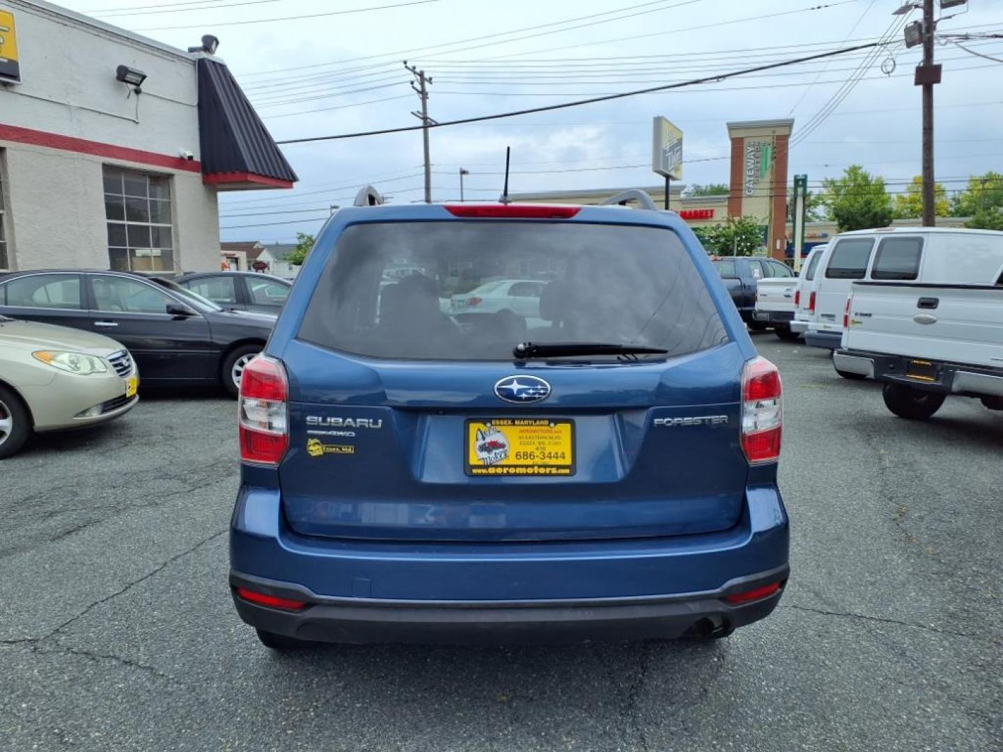 2014 Marine Blue Pearl Subaru Forester 2.5i Premium (JF2SJAEC4EH) with an 2.5L 2.5L H4 170hp 174ft. lbs. Sequential-Port F.I. engine, CVT transmission, located at 50 Eastern Blvd., Essex, MD, 21221, (410) 686-3444, 39.304367, -76.484947 - Photo#3